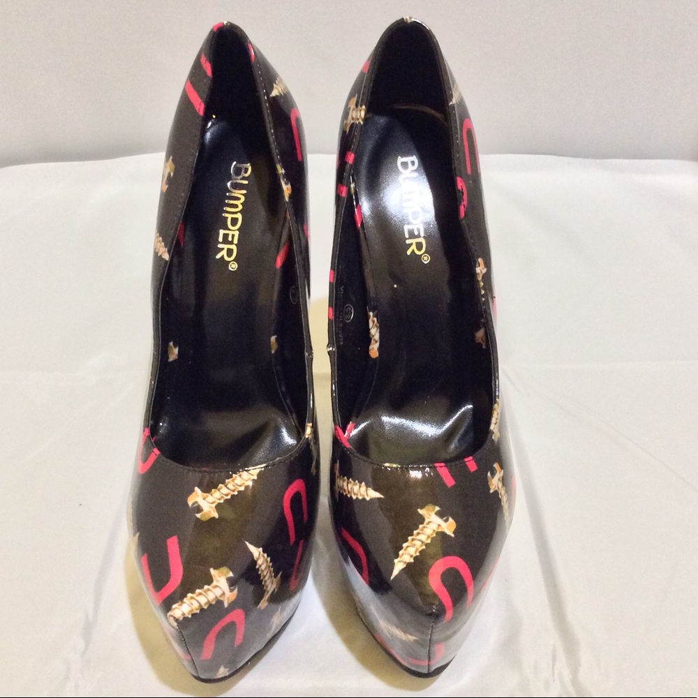 Screws and U’s black platform Pumps by Bumper